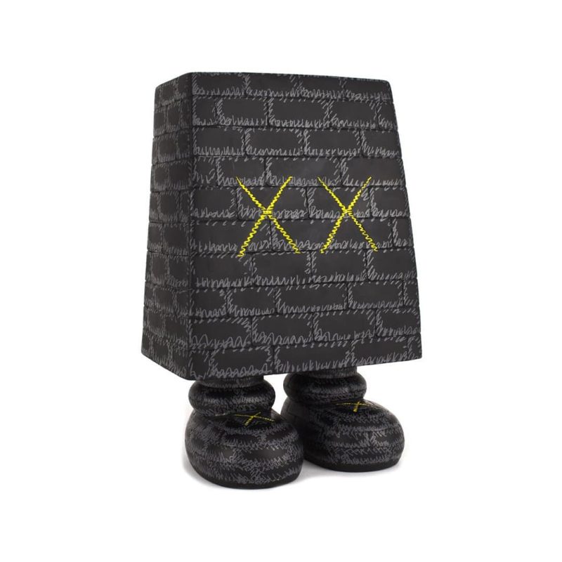 kaws wonderwall vinyl figure black displayed 254614